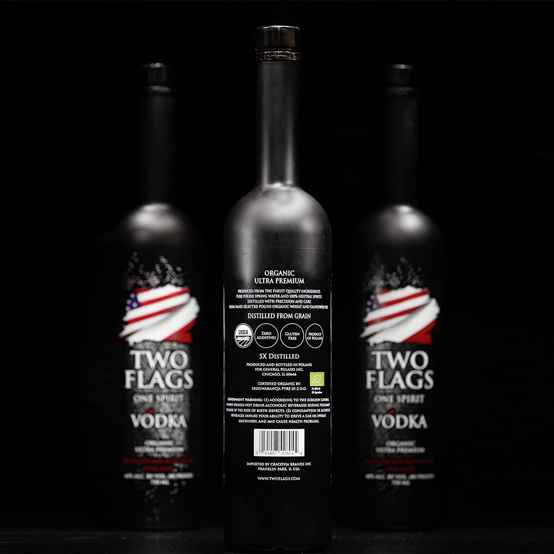 Bottle of Two Flags One Spirit Vodka featuring organic ultra-premium vodka label and American flag design. Ultra-Premium Organic Vodka