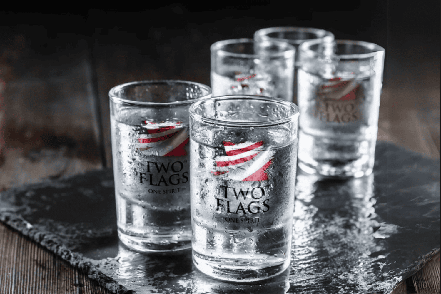 Two Flags Organic Ultra Premium Vodka in Shot Glasses on a slate tray